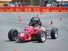 A driver tests a "Formula 1" car on Busch campus during Rutgers Day 2018.