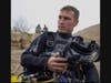 In this 2009 photo, Navy diver Daniel Muhlbach listens to instructions before beginning a dive to search for a missing 82nd Airborne Division soldier in the Murghab River in Afghanistan.