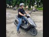 Evan Charles Keeton works on his scooter skills at a practice course in Taichung City.