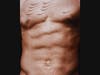 This a detail of Scarred Chest, a 2003 digital chromogenic print by Hank Willis Thomas.