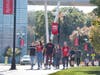 Students walk on a sidewalk near the Rutgers Business School on Livingston campus in this October 2021 photo.