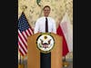 Christopher Slipiec speaks at the podium during a Fulbright graduation ceremony held at the Polish Chief of Mission's residence in Warsaw.