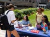 A student talks with undergraduates Tesia Yachimovicz (second from left) and Tania Saravanakumar (right) as well as Monica Dunkerson (second from right) at The Yard in New Brunswick, N.J.