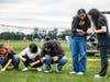 Rutgers Honors College students examine turfgrass at Adelphia Farm in Freehold, N.J. on Sept. 11.