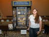 Mya Stettinger of High School In the Community (New Haven) in front of her prize winning exhibit "Progress, Backlash, and Denial: The Tulsa Race Massacre through the Lens of Revolution, Reaction, and Reform."