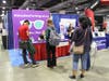 Visitors stop by the Shades for Migraine booth