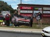 Protestors with signs demanding Ahold Delhaize go cage-free.
