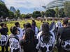 Band members from Matteson School District 162’s junior high school cheer for Rich Township 227’s band during the Battle of the High School Bands at the Chicago Football Classic on Saturday. 