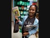 Illinois School fourth grader Giselle Carter, 9, was the first student to choose a book from the new book vending machine.