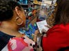 District 162 Assistant Director of Special Education Rebecca Dixon, left, and Director of Special Education Jaime Goodley check their supply list while shopping for students at Walmart during the July 31 Making Disciples shopping trip.