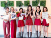 Tri.Be poses with decorations from the @kpop_in_mass fan cafe at Bubble Nation
