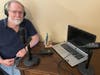 Mike Allen in his Danbury podcast studio, where he produces "Amazing Tales from Off and On Connecticut's Beaten Path" about local history throughout Connecticut