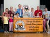 Mayor Martin Rutyna accepts a birthday card signed by the students of W.L. Morse on behalf of the Village of Sleepy Hollow