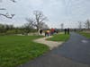 Volunteers gathering to clean up the outdoor fireplace area