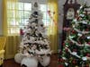 A stunning, white-themed tree display anchors the holiday decor, complemented by seasonal touches throughout Lake Forest Park.