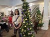 Local businesses showcase their creativity with uniquely decorated trees throughout Lake Forest Park's lobby during the Festival of Lights celebration.