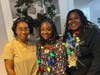 During the celebration, team members showcase their holiday spirit with bright smiles and festive decorations.