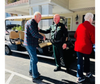 Sheriff Del Toro and a resident share a warm exchange, as residents and the local community join for a fun-filled BBQ event.