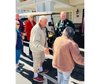 First responders and residents engage in casual conversation, building bridges between law enforcement and the community they serve.