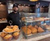 Juniper Village at Chatham's Bistro Chef, Brett Byars stands proudly in the new William Pitt Cafe!
