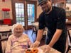 Smiles all around as Chef Brett Byars serves resident Jennie Martin at the brand new William Pitt Cafe!