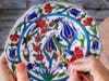 The gift items designed, manufactured, and sold by veterans trained by Help R Heroes include small wooden tables, beaded necklaces, painted decorative plates, and many other handcrafts. 