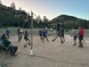 Playing “Cow Ball” against another troop while at a staffed camp 