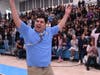 LET'S GO!  Still taking it all in, Caleb Flores makes his way down from the bleachers to accept the Milken Educator Award. 