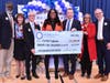 Visiting dignitaries congratulate Comfort Agboola on her Milken Educator Award recognition. 