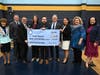 Distinguished guests congratulate Joseph Kielminski on his Milken Educator Award. 