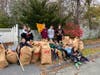 Youth volunteers who raked leaves for a Woburn senior during the 2023 SCI Leaf Raking Event. 