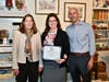 Megan Beste, District Director for Rep. Susan Wild, presents a Certificate of Special Congressional Recognition to Schropp Dry Goods Shoppe for its ribbon-cutting, joined by HBMS President & CEO LoriAnn Wukitsch and Mayor J. William Reynolds.