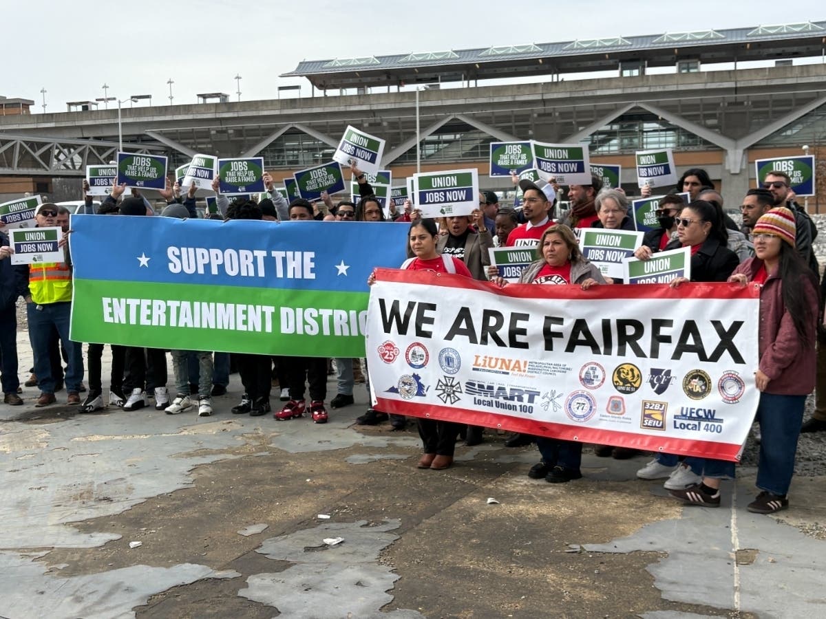 On Wednesday, about 100 people representing a coalition of Northern Virginia unions rallied in support of Senate Bill 756 at a vacant lot near the Spring Hill Metro station in Tysons.