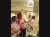 A member of a River Edge Brownie Girl Scout Troop and an employee of Juniper Village at Paramus read an excerpt from "I Am Ruby Bridges" by Ruby Bridges.