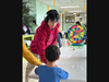 Playing games with young residents at Saturdays in Motion.