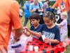 Children delighted in a hands-on ladybug release at the 2026 Trinity Falls Trail Day 5K