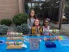 First-graders from South End Elementary School sell handmade bracelets to raise funds for the Friends of the Cedar Grove Public Library at the Library Open House and Brick Display on Saturday, September 19, 2026.