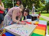 Gemma Klinkowstein came up from NY to visit a friend.  She stopped by the Ridgefield Arts Council table where she participated in a collective thumbprint art project.  Klinkowstein commented, “This is a really fun event.  Great to see the community. “
