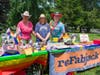 Carolyn Onorato, clad in pink, the owner of reFabjack went above and beyond by donating 100% of their proceeds to Ridgefield Pride for everything sold at Pride in the Park on June 6, 2026.  