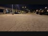 Severe uneven spots in the parking lot at night.