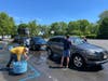 Youth and adult volunteers participate in car wash fundraiser for Appalachia Help Weeks.
