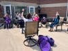 Residents participate in outdoor exercises on the patio at Ridge Crest