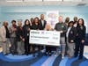 Ross Ellis, CEO and Founder STOMP Bullying and Jess Linder, New York Jets VP of Community Relations present a $15,0000 check from STOMP Out Bullying, New York Jets and Solomon Thomas, co-founder of The Defensive Line, to support the initiative.