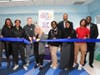Ross Ellis, CEO and Founder of STOMP Out Bullying and Jesse Linder, New York Jets, VP of Community Relations inaugurate new Wellness Room at East Orange Campus High School with ribbon-cutting ceremony alongside staff and students of the school.