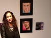 Artist Vian Borchert next to her David Bowie Portrait Paintings at the National Liberty Museum