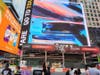 "Spectrum" in a digital display in Times Square on Broadway