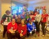 Associate have fun showing off their festive and creative ugly sweaters.
