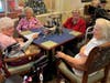Residents gather in community spirit as they enjoy delicious food and listen to John Lepre’s great music!