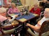Residents gather around festively decorated tables during the New Year’s Eve celebration, sharing in the excitement of welcoming 2025.