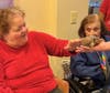 A resident shares a delightful moment with Maple the Turtle during Tenafly Nature Center’s monthly visit.